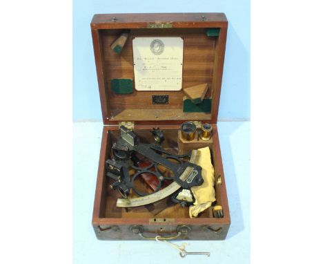 A Hezzanith black lacquered sextant retailed by F. Robson & Co. Newcastle, housed in a fitted wooden case.