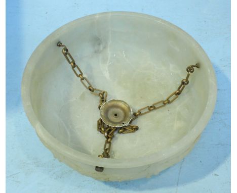 A large alabaster light shade, the sides decorated with cherubs and foliate moulding, together with suspension chain and fitt