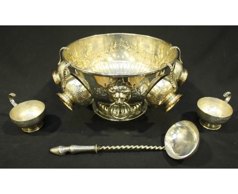 A silver-plated punch bowl with six cups and associated ladle