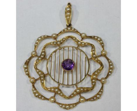 A 15ct gold openwork pendant set with amethyst and seed pearls.