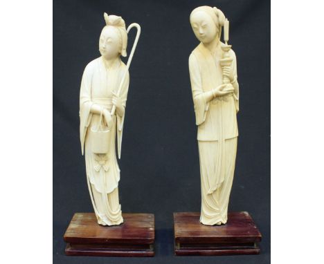 A pair of Qing Dynasty Chinese carved Ivory figures of Immortals, one carved as Lan Caihe holding a bamboo basket and staff, 