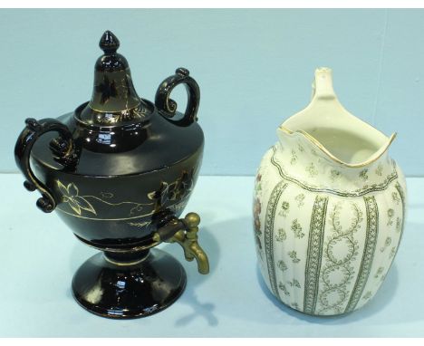 A Victorian ceramic Samovar tea urn with brass spigot and two handles, black ground with gilded leaf decoration, 35cm high, t