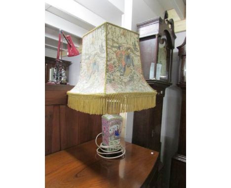 An oriental style table lamp with shade