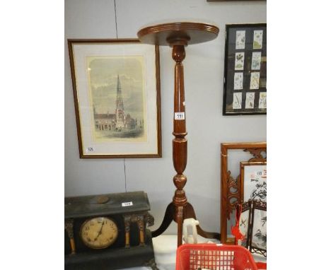 A tripod pot stand