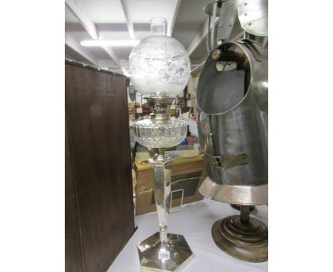 A silver plate oil lamp with glass font and etched shade