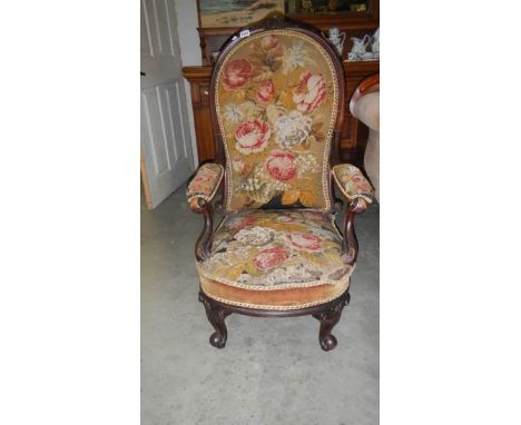 A mahogany framed chair with tapestry seat and back