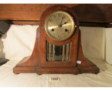 An oak mantel clock