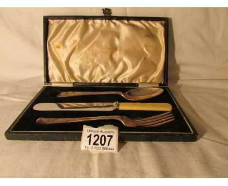 A cased 3 piece cutlery set comprising a silver fork, a silver desert spoon and an EPNS knife