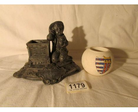 A Carlton ware match striker and a Victorian spelter match striker