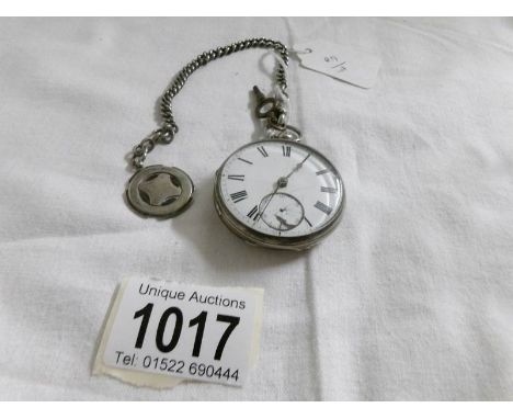 A silver pocket watch 1859/60, working but dial a/f, complete with key, silver chain and silver watch fob