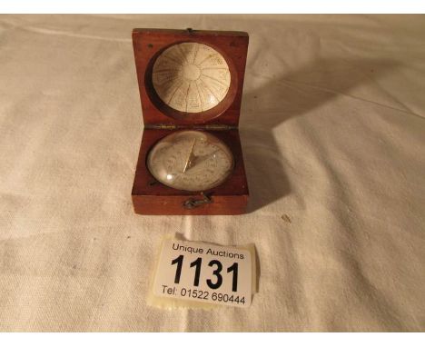 A Georgian pocket sundial / compass (probably Charles Nephew & Co Calcutta)the sundial with paper dial, the lid with calendar