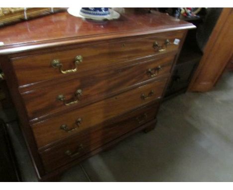 A mahogany 4 drawer chest on bracket feet and with brass drop handles, height 83 cm, width 92 cm