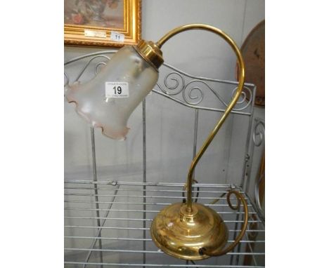 A brass swan neck reading lamp with glass shade and a table lamp with glass shade