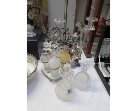 A cruet, 2 vinegar bottles and an epergne (missing centre trumpet)