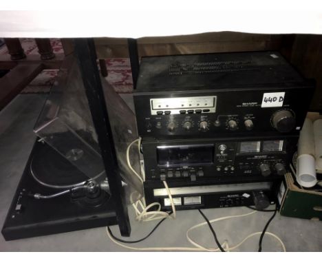 A Sharp record deck with stereo tuner and amplifier and cassette deck