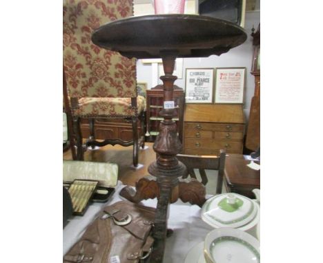 A mahogany side table on carved tripod base and carving to top