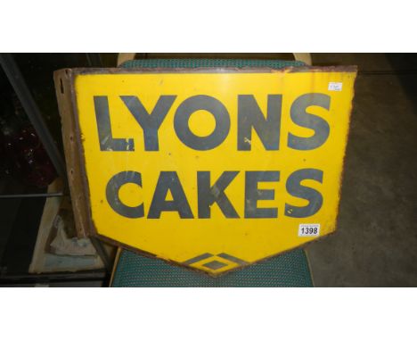 A double sided Lyons cake enamel sign
