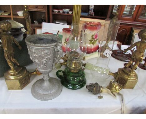 A green glass hand oil lamp and other oil lamp parts