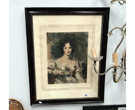 A framed and glazed portrait print of a young lady