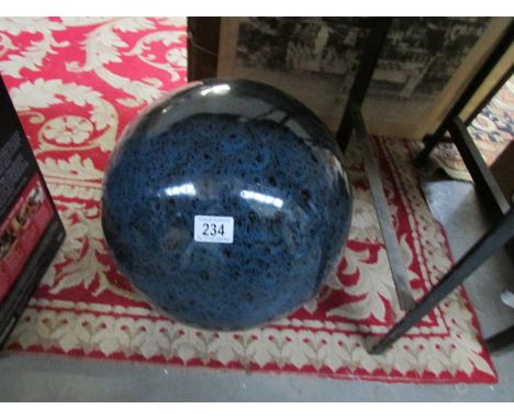 A large ceramic ball garden feature