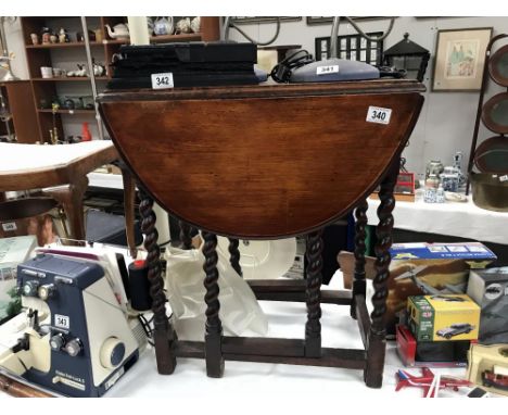 A small oak barley twist gate leg table
