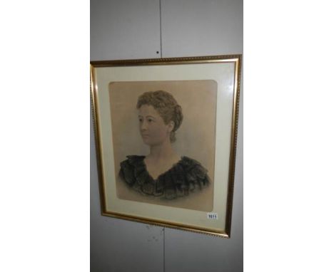 A framed and glazed portrait of a young lady
