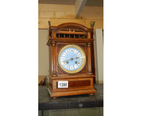 A mantel clock with enamel dial