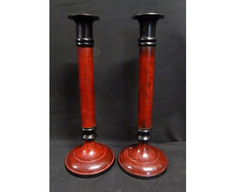 A Pair of Ebonised and Enamel Candlesticks, 26 cms tall
