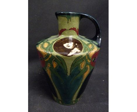 A Gouda Art Nouveau Jug with a transfer printed portrait, 15 cms tall