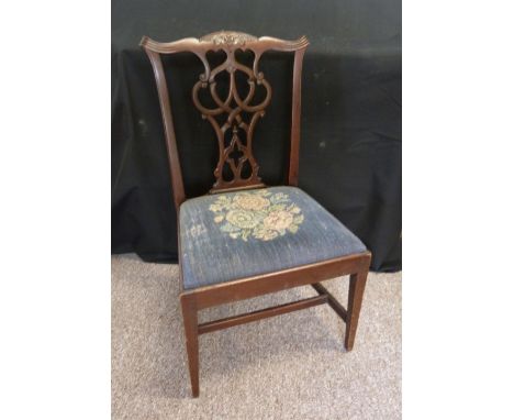 A 19th Century Mahogany Child's Chippendale Style Side Chair, with a carved pierced splat back above a drop-in seat raised up