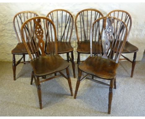 A Group of Four Late 18th or Early 19th Century Yew and Elm Windsor Side Chairs, each with a stick back above a panelled seat