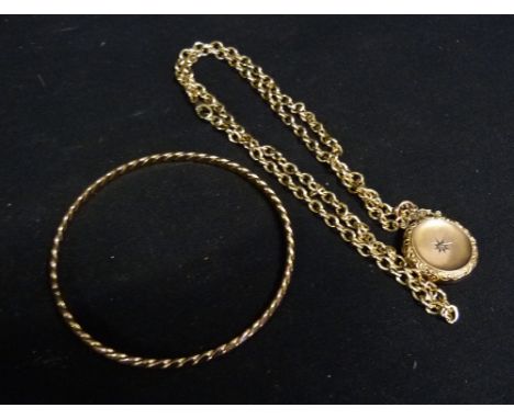 A 9ct. Gold Locket set with a single diamond, together with a 9ct. gold chain and a 9ct. gold bangle, 31.7 gms