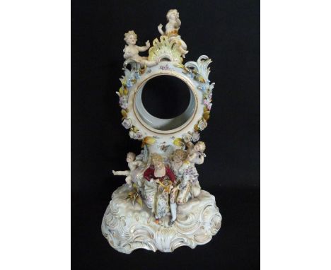 A Late 19th Early 20th Century Dresden Porcelain Table Clock, decorated with figures and putti amongst foliage and highlighte