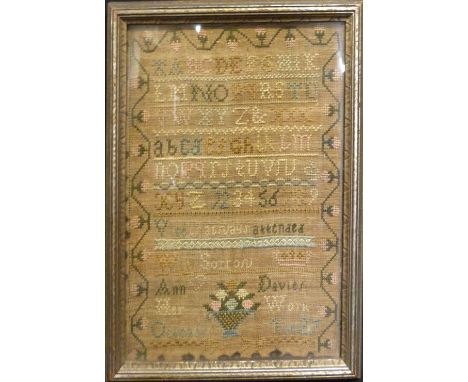 A George III Woolwork Sampler by Ann Davies, dated 1779, 27 cms x 20 cms