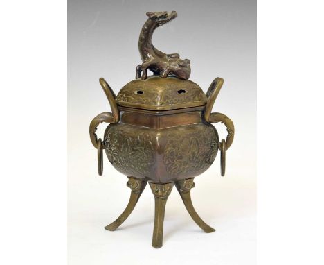 Japanese bronze koro with diamond-shaped domed cover with qilin finial, raised on four splayed supports, 29.5cm high