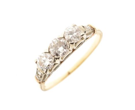 Three stone diamond ring with diamond set shoulders, size Q approx, the shank stamped '14K-18k', 3g gross approx