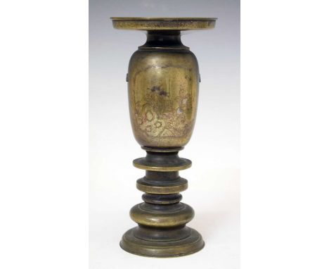 Japanese Meiji period bronze vase, with everted neck over ovoid body decorated with panels of rockwork and foliage, raised on