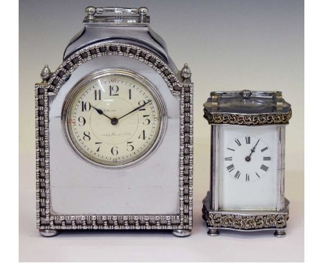 French silvered mantel clock having a convex Arabic dial, 15cm wide x 22.5cm high (ex.handle), together with a silvered Louis