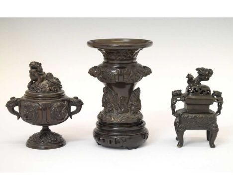 Japanese bronze vase with figure and mask decoration, 12cm high (ex.stand), together with two bronzed koros, both having Dog 