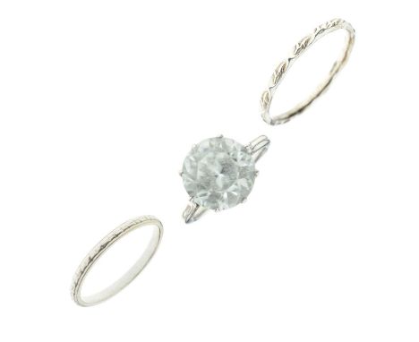 Single stone ring set large white faceted stone, the white metal shank stamped '18ct', size K approx, 4.3g gross approx, toge