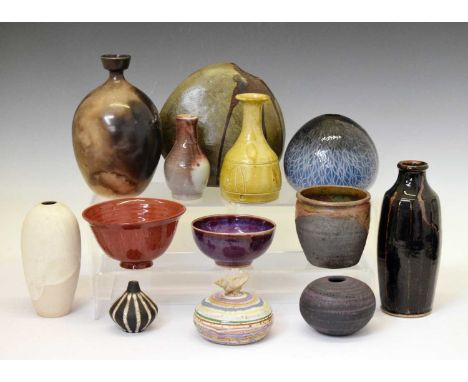 Studio pottery - Amanda Brier for Leach Pottery, red glazed flared footed bowl with cut flue sides, impressed mark, together 
