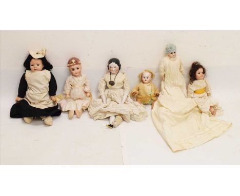 Group of late 19th/ early 20th Century dolls to include; glazed ceramic head doll over cloth body and ceramic lower limbs, un