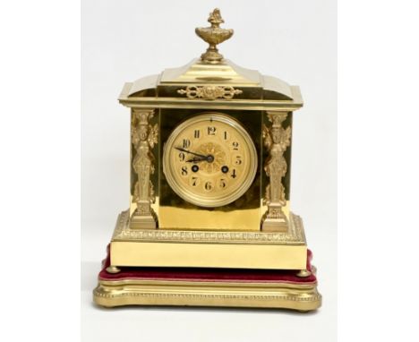 A late 19th century French brass mantle clock on stand. L. Marti Medaille D’Argent 1889. With key and pendulum. 30x17x39.5cm 