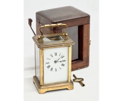 Whytock &amp; Sons. A Late 19th/Early 20th Century brass carriage clock by Whytock &amp; Sons. With original leather case. 