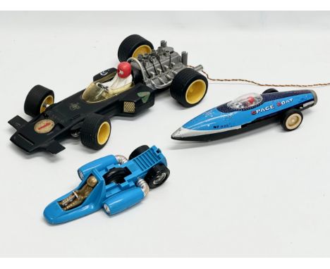 3 vintage toy racing cars. A Sanchis Bradgate JPS remote control racing car. An MF 895 Space Boat tin plate rocket ship. 