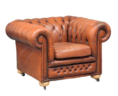 A deep button leather Chesterfield club armchair 