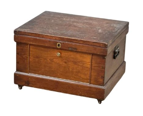 A late 19th century pine fitted trunk with drop down front, original paintwork.  68x57x46cm 