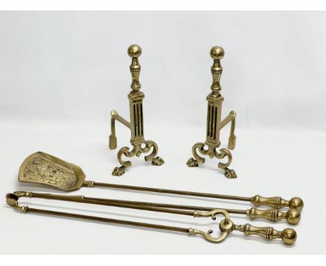 A set of vintage Victorian style brass fire andirons and matching tools. Andirons 15x16x35cm. Tools 72cm 