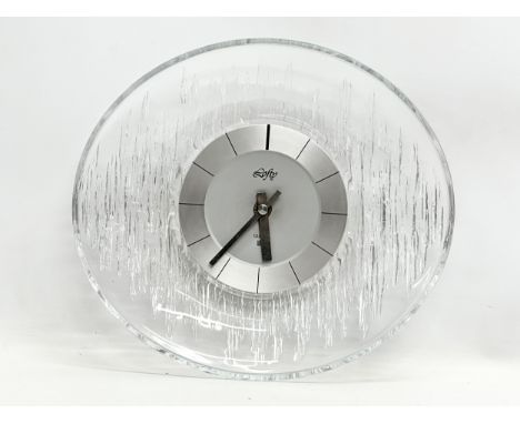 A Lofty Hoya glass wall clock. 29x26cm 