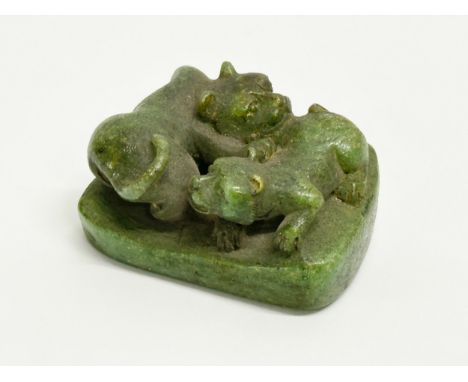 A Late 19th Century signed Netsuke stone miniature. 